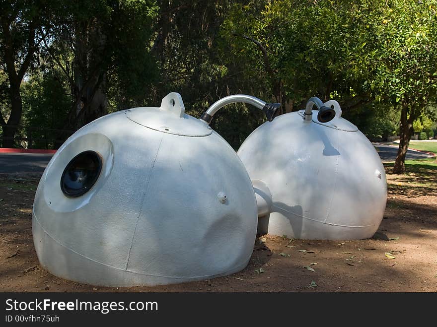 Nautical buoys transformed into water tanks in the garden