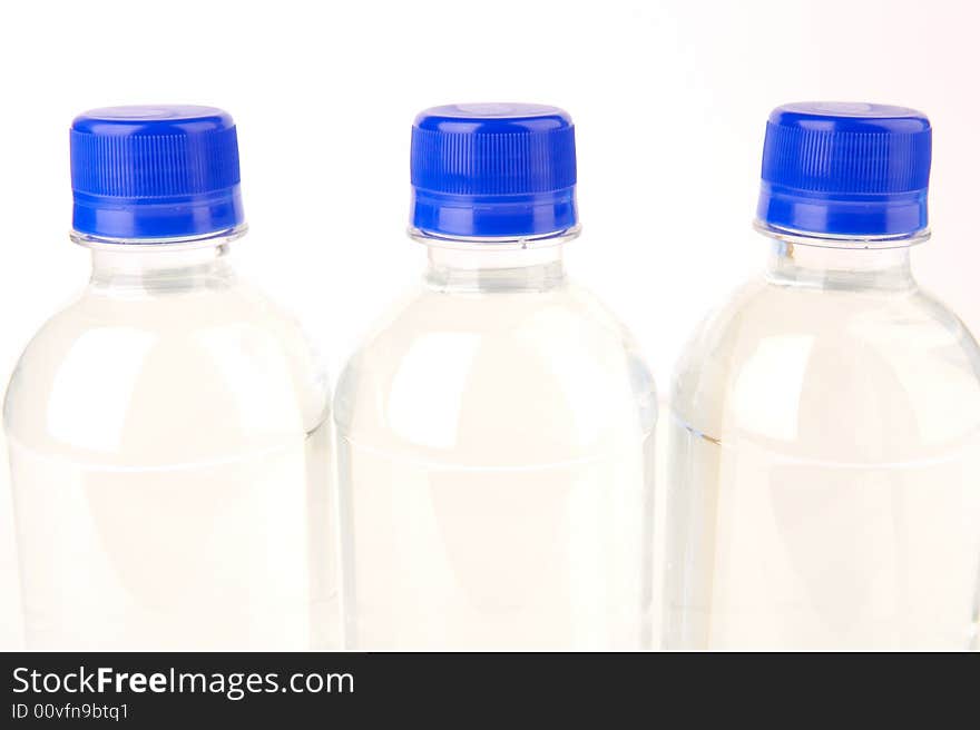 Bottled water isolated against a white background