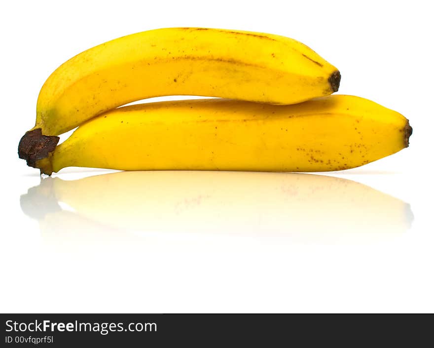 Ripe bananas on white. Shallow DOF.