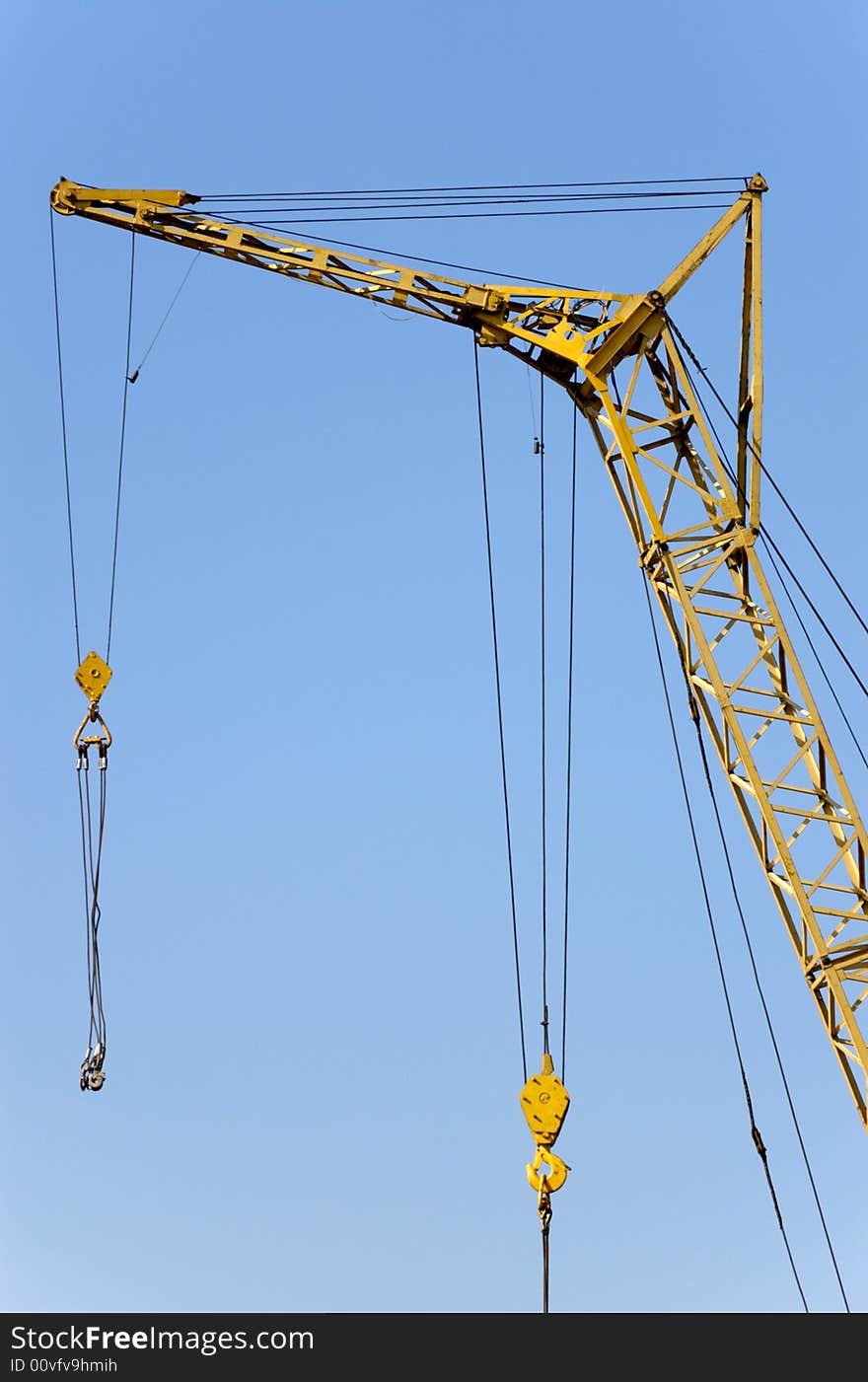 Lifting crane with two hook on a construction site