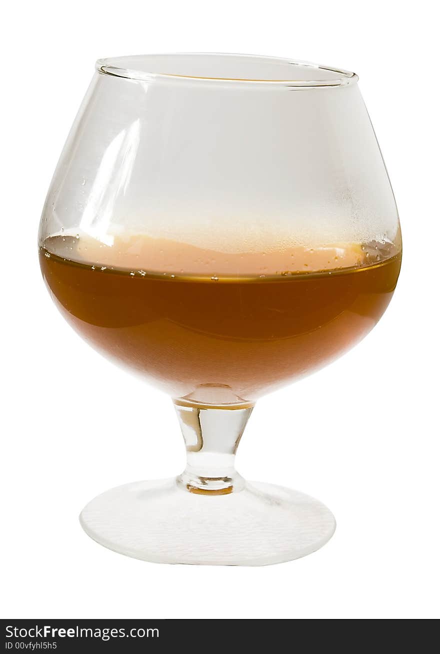 Isolated glass of warm cognac