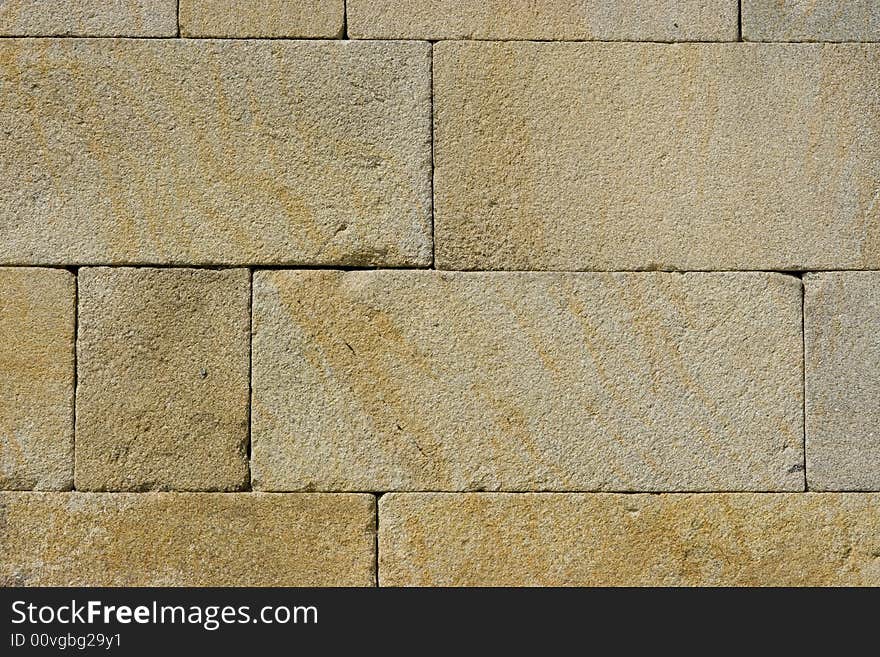 Texture of a wall made of granite. Texture of a wall made of granite