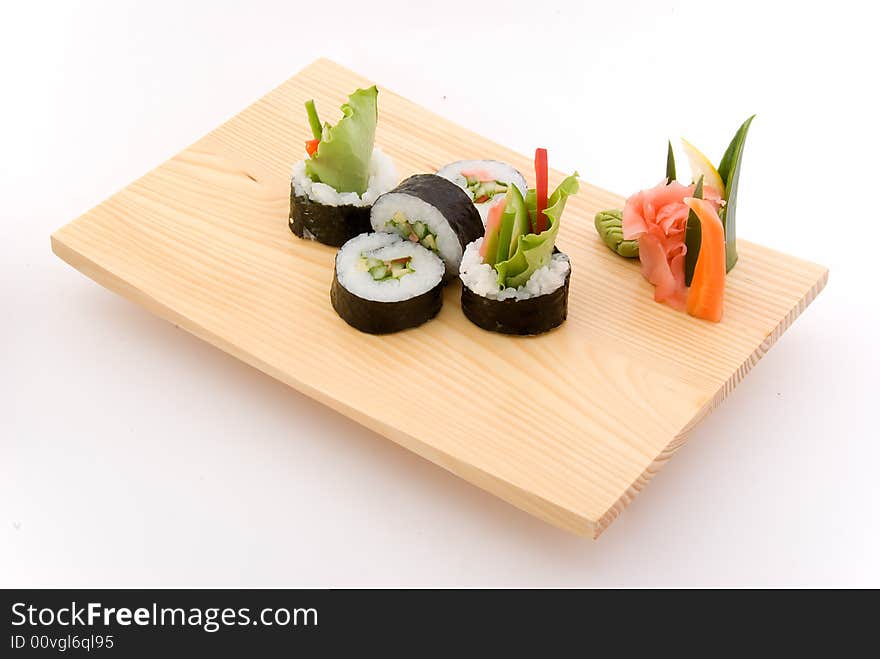 Vegetarian roll on wooden plate