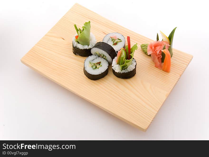 Vegetarian roll on wooden plate. Vegetarian roll on wooden plate