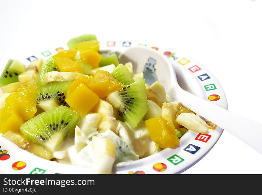 Fruit salad in a plate isolated on a white background. Fruit salad in a plate isolated on a white background