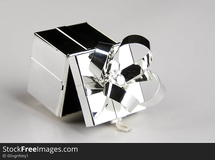 Gift box made of steel isolated over light background