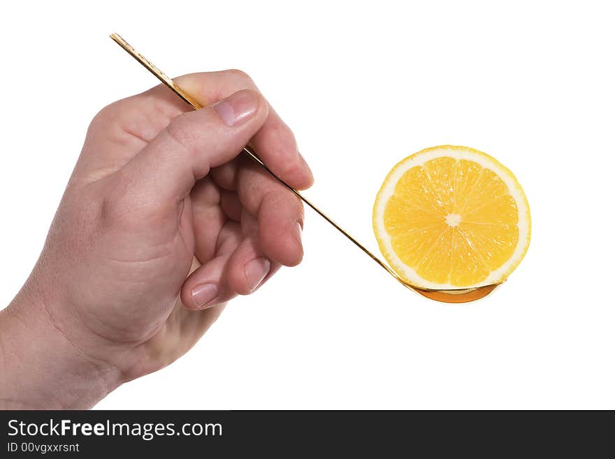 The hand holds a teaspoon with lemon. Isolated on white [with clipping path]. The hand holds a teaspoon with lemon. Isolated on white [with clipping path].