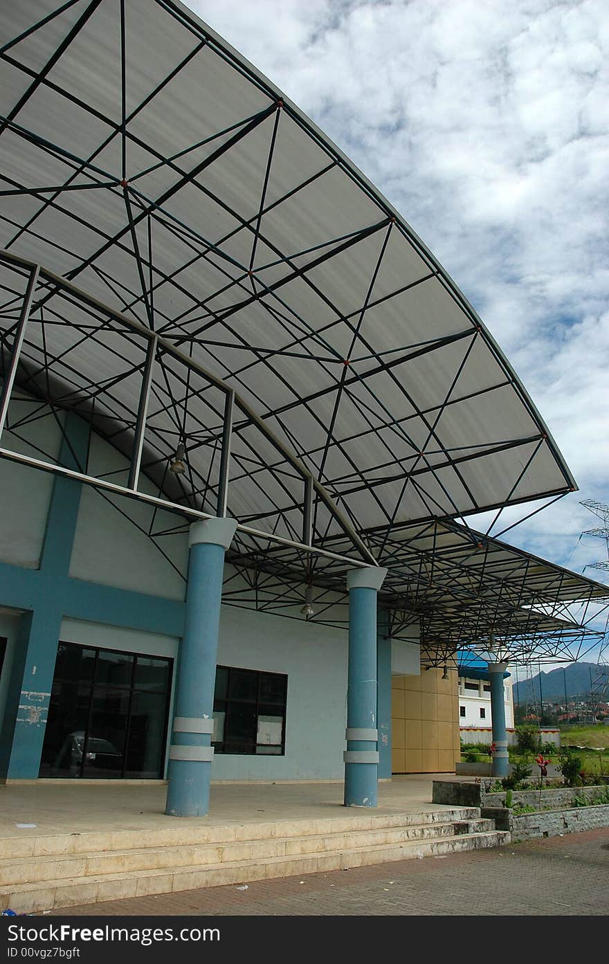 Left side University Gym building with sky as a background