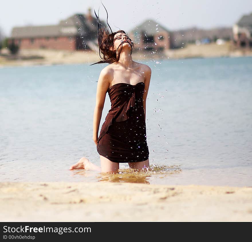 Beautiful girl modeling at the beach. Beautiful girl modeling at the beach