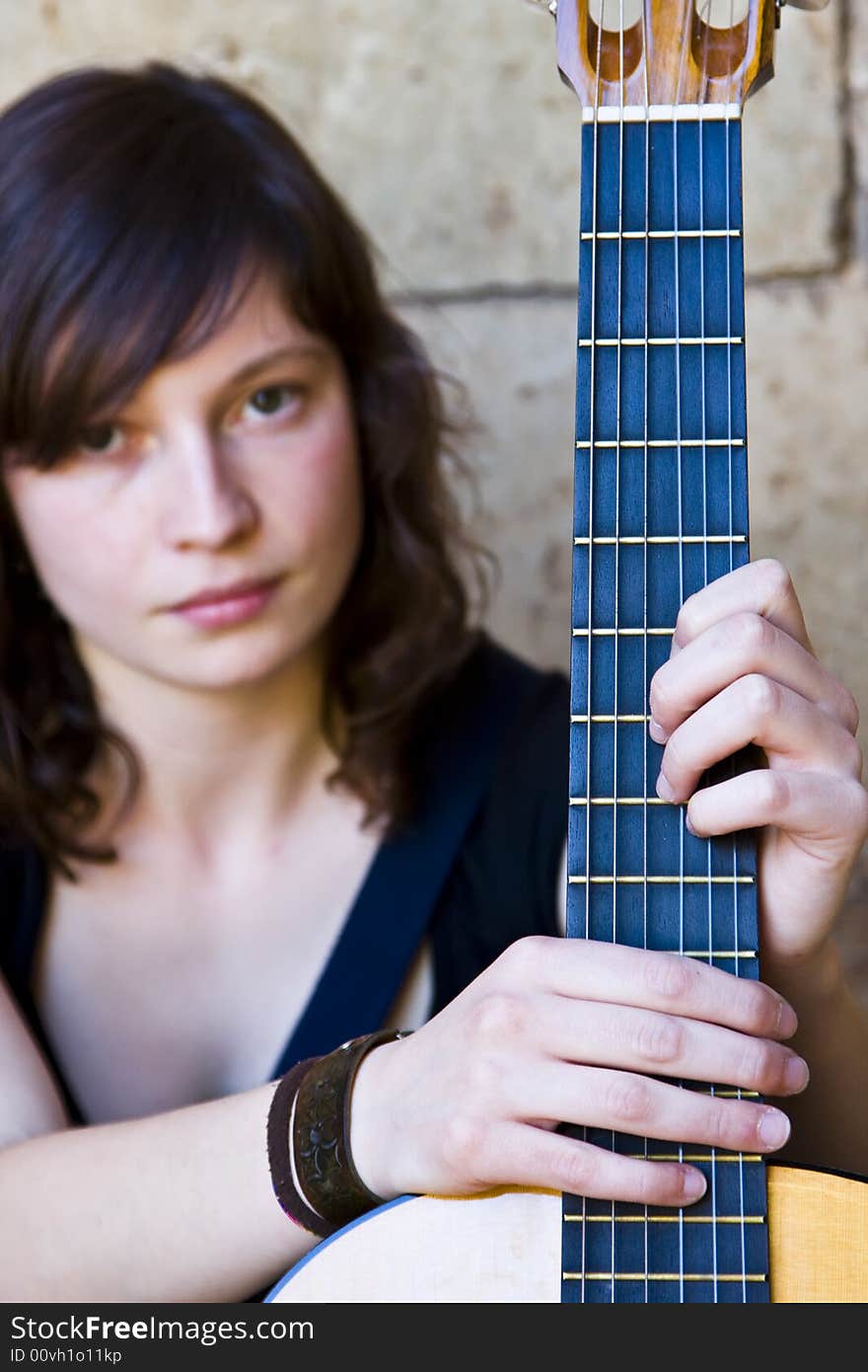 Soft focused guitar performer portrait. Soft focused guitar performer portrait.