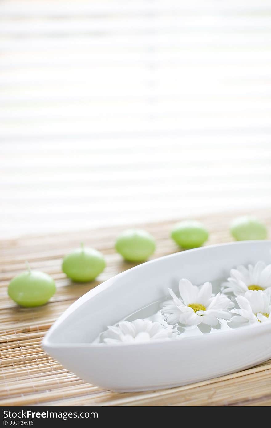 Bowl full of water, fresh flowers and candle / copyspace. Bowl full of water, fresh flowers and candle / copyspace