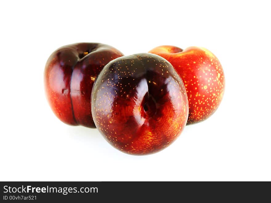 Three fresh ripe sweet plums