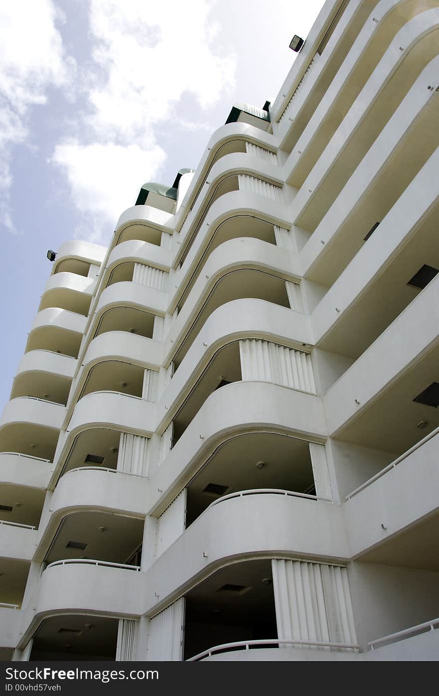 Exterior side wall of apartment building with pattern of balconies