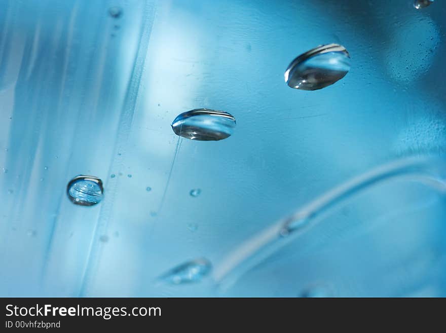 water drops in blue bottle. water drops in blue bottle