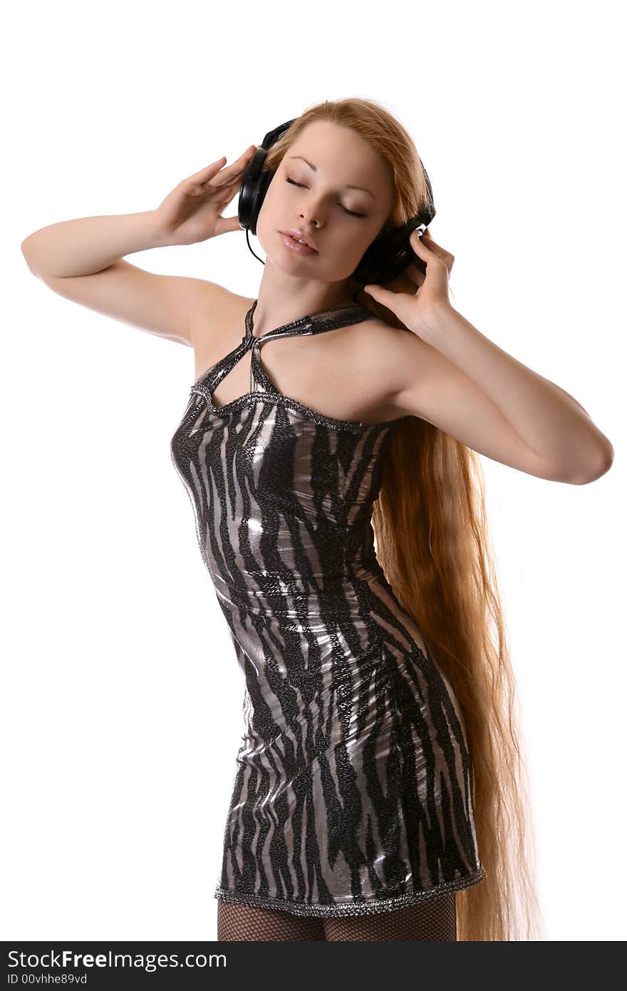 girl listens to music through headphones