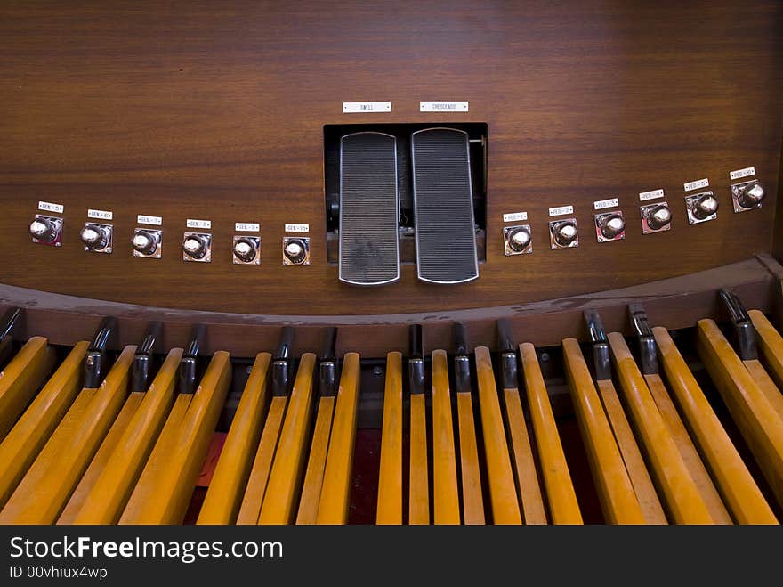 Picture of organ pedals inside a church. Picture of organ pedals inside a church