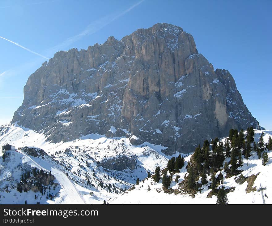 Mount Sassolungo during winter with snow. Mount Sassolungo during winter with snow