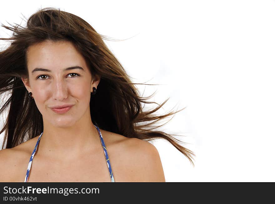 Confident teenage girl with long brown hair and a wry smile