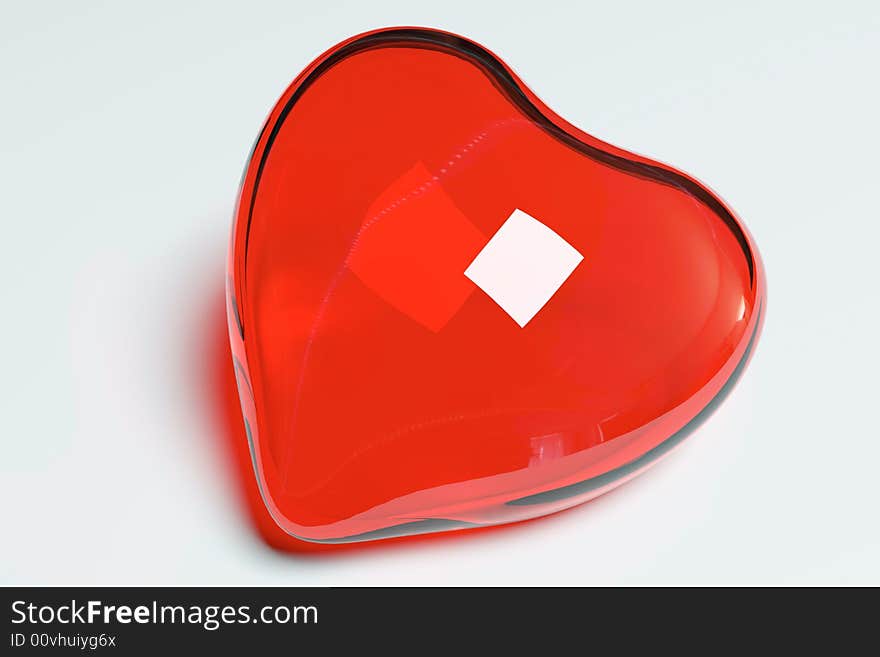 Red glass heart on the white background