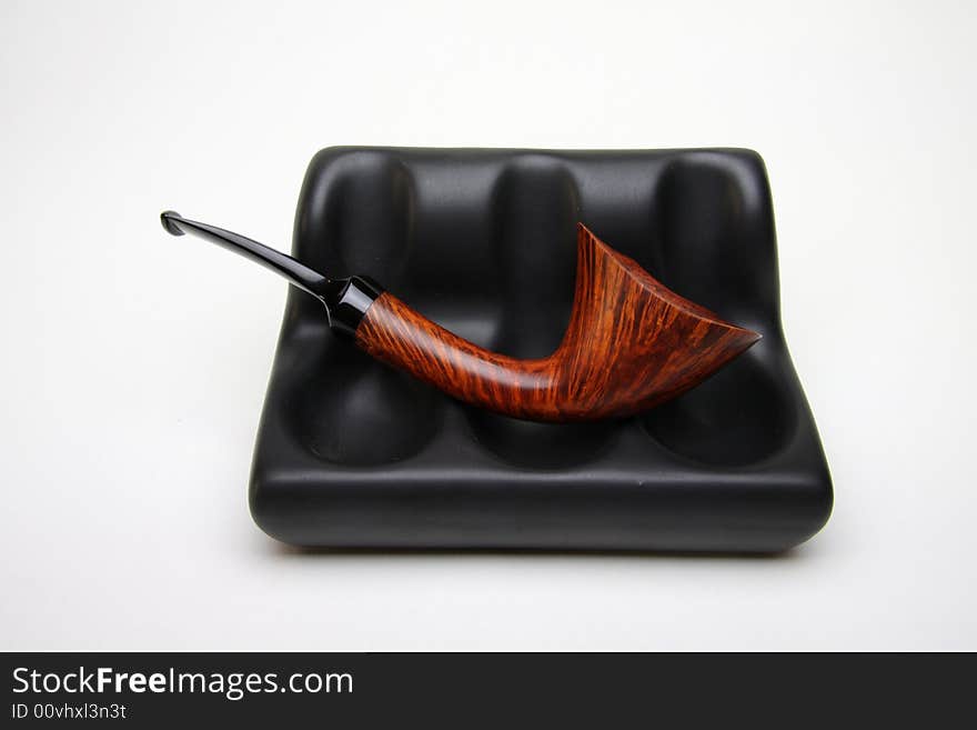 Tobacco pipe isolated on white.