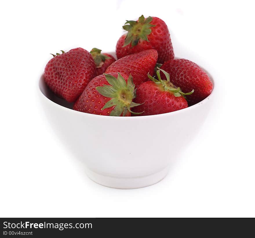 Red strawberries in white bowl on white background, fresh and tasty. Red strawberries in white bowl on white background, fresh and tasty