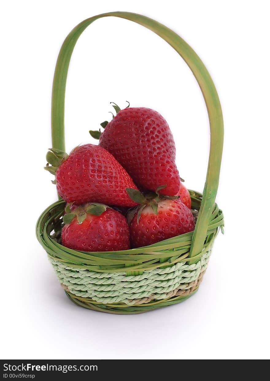 Red, fresh, tasty strawberries in small wicker basket. Red, fresh, tasty strawberries in small wicker basket