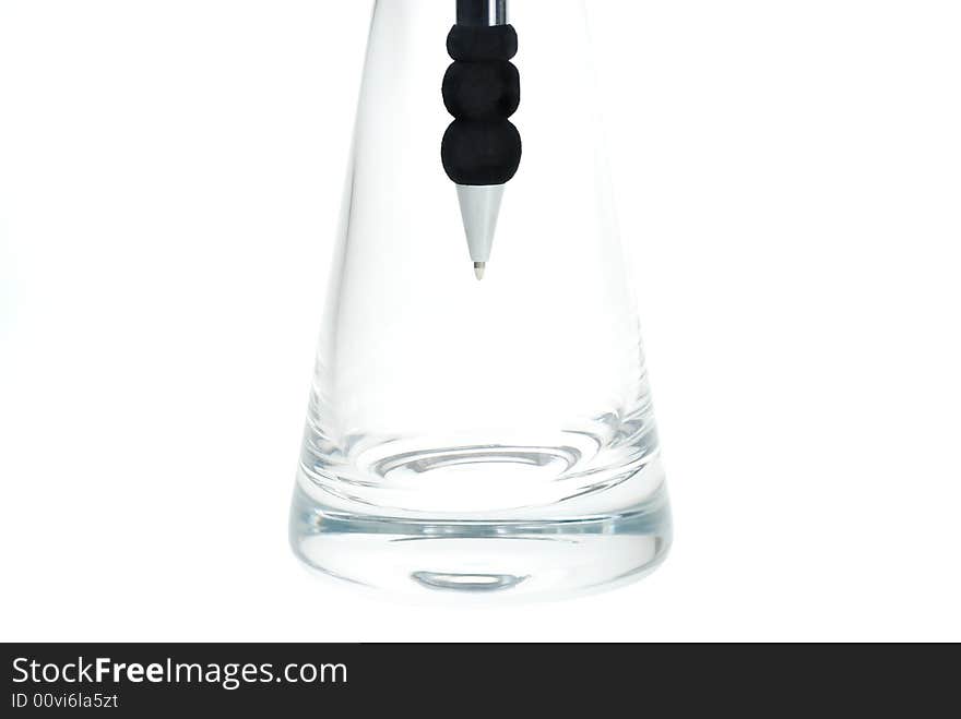 Metallic Pen placed in glass tube shaped vase