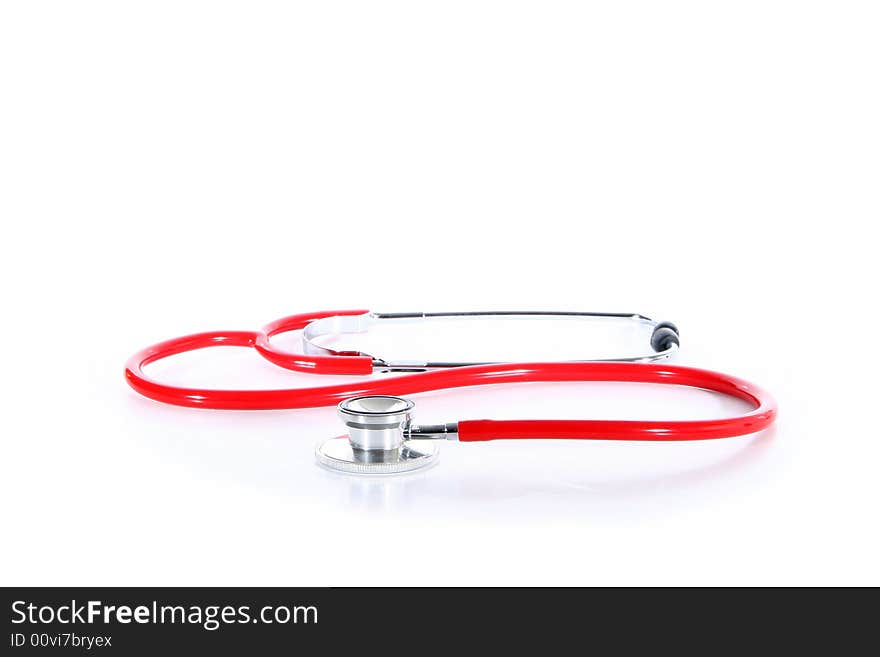 A red stethoscope over white background.