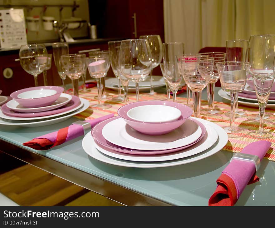 Table served on some persons. Set of glasses. Violet service. Table served on some persons. Set of glasses. Violet service