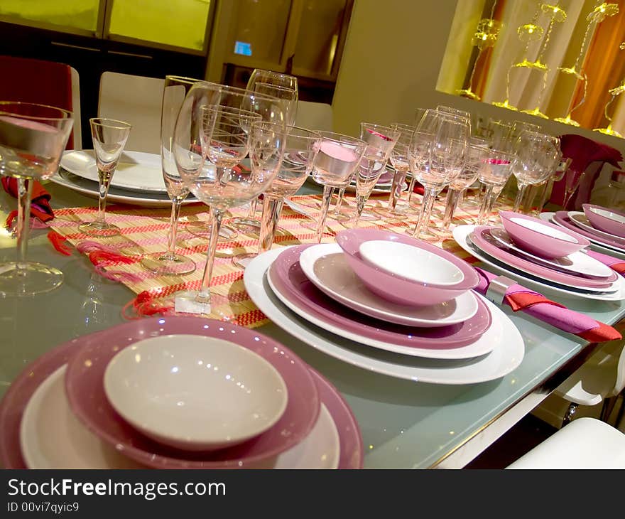 Table served on some persons. Set of glasses. Violet service. Table served on some persons. Set of glasses. Violet service