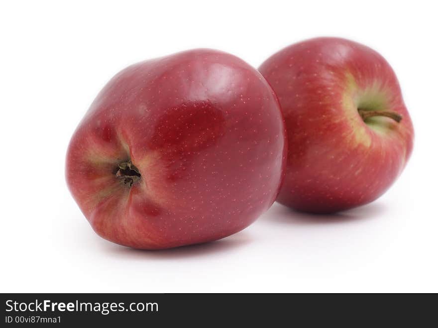 Two red apples on white background, fresh and tasty. Two red apples on white background, fresh and tasty