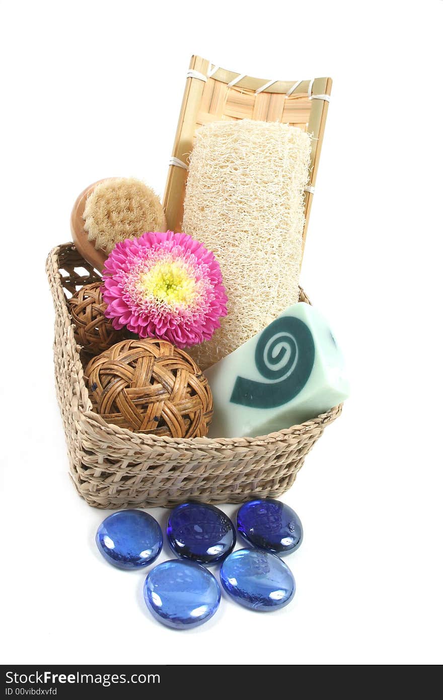 Spa and beauty products in a basket isolated on white.