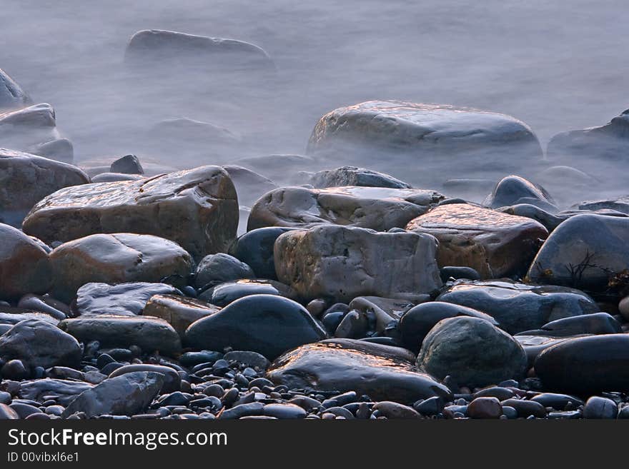 Stones on the atlantic shore after sunset. Stones on the atlantic shore after sunset