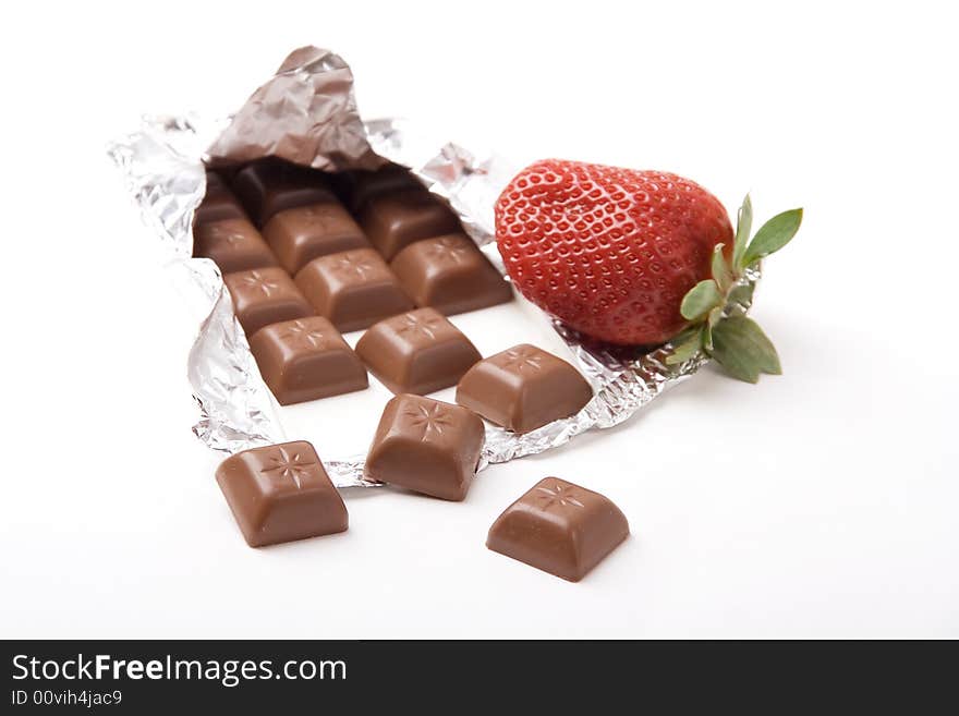 Chocolate bar with a fresh red strawberry. Chocolate bar with a fresh red strawberry