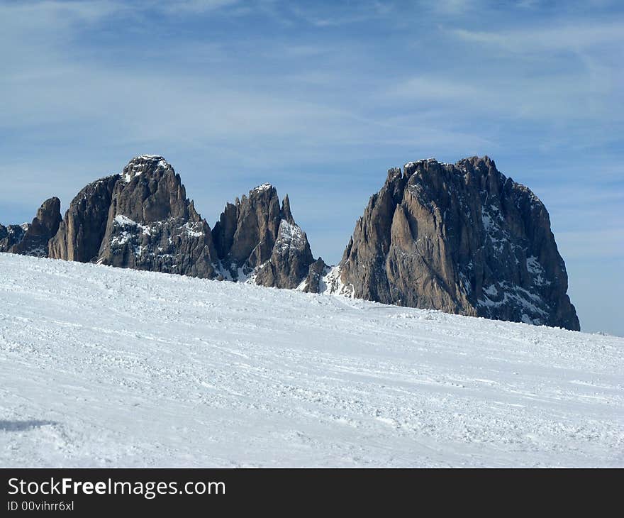 Mount Sassolungo during winter with snow. Mount Sassolungo during winter with snow