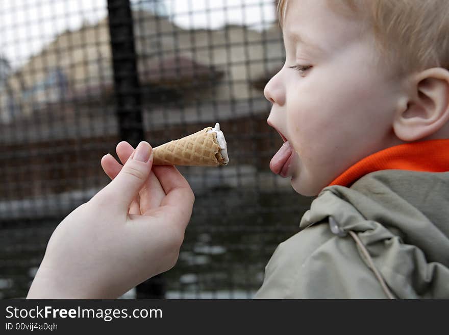 The child and the ice cream outdoor. The child and the ice cream outdoor