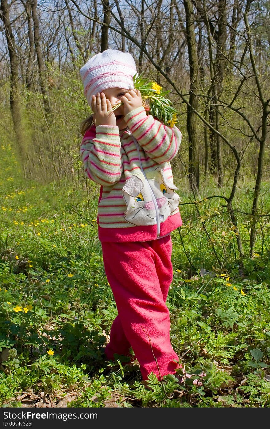 Little girl hiding in the forest. Little girl hiding in the forest