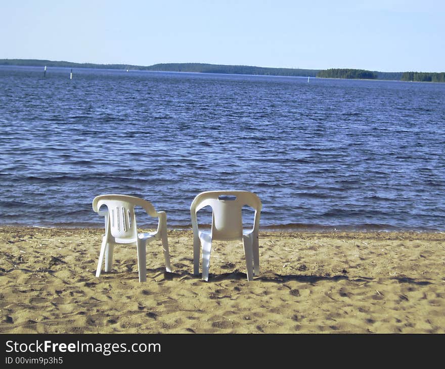 Two chairs on the coast