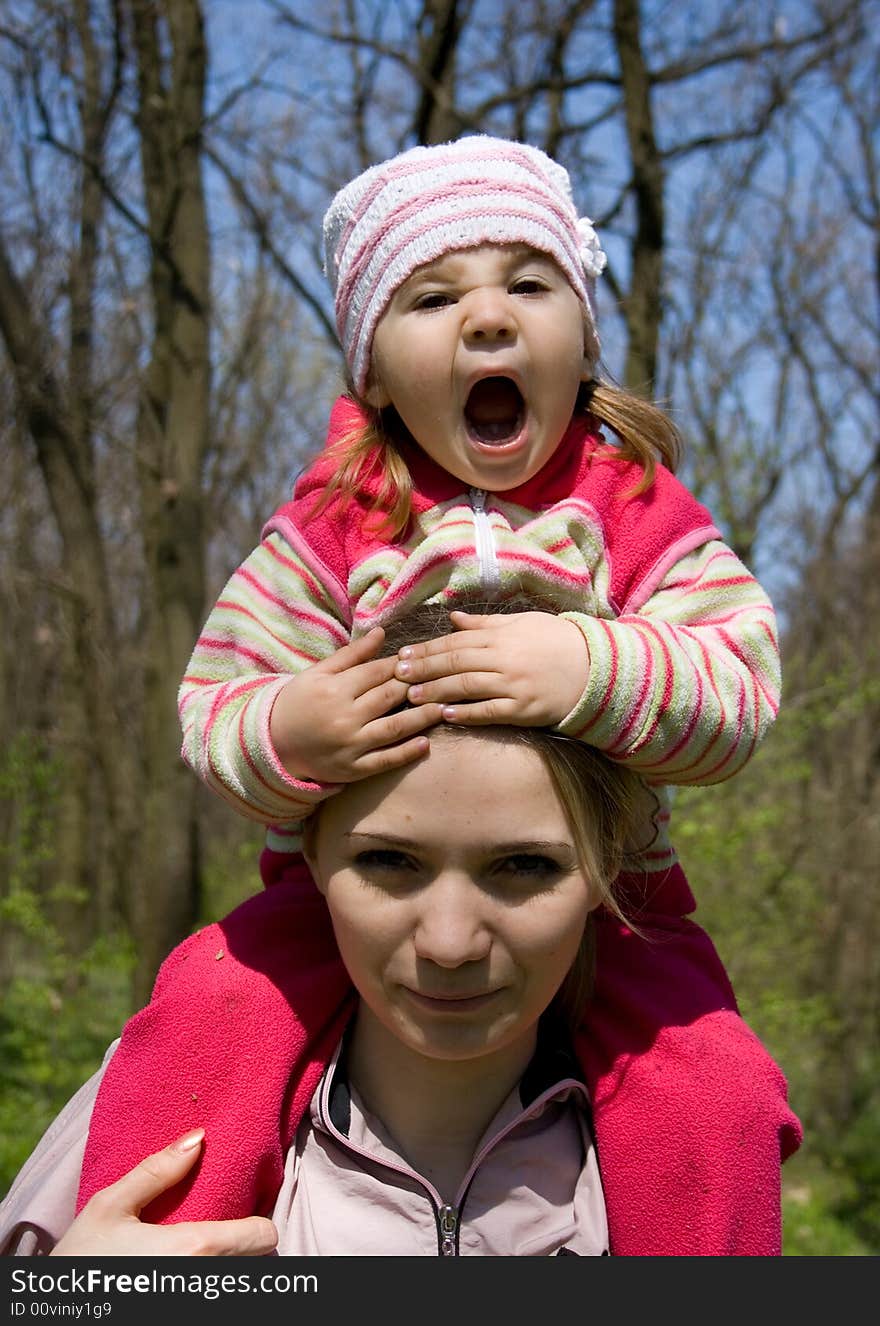 Smiling girl with her mother. Smiling girl with her mother