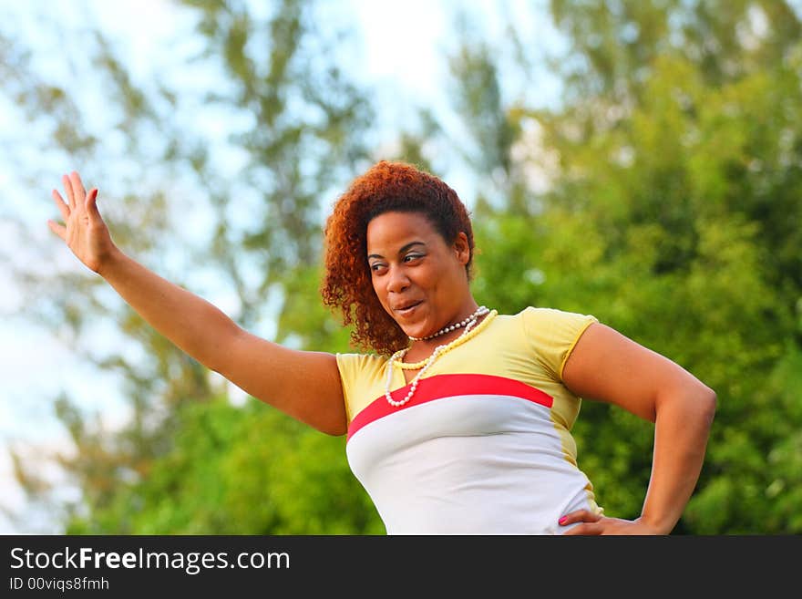 Woman waving to the crowd