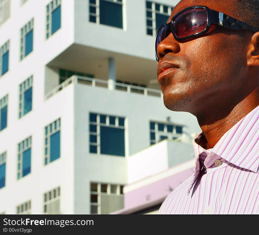 Man's face with a building in the background. Man's face with a building in the background.