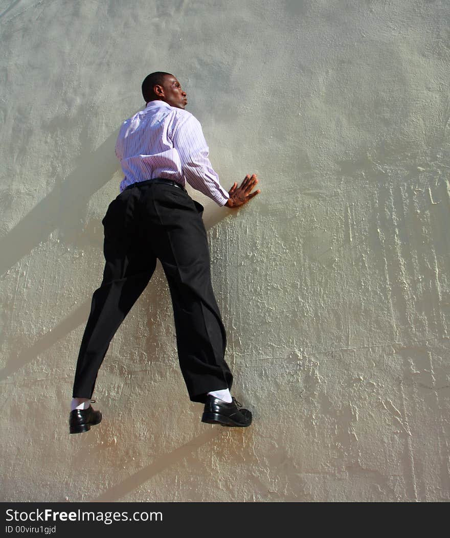 Man who appears to be stuck to the wall. Man who appears to be stuck to the wall.