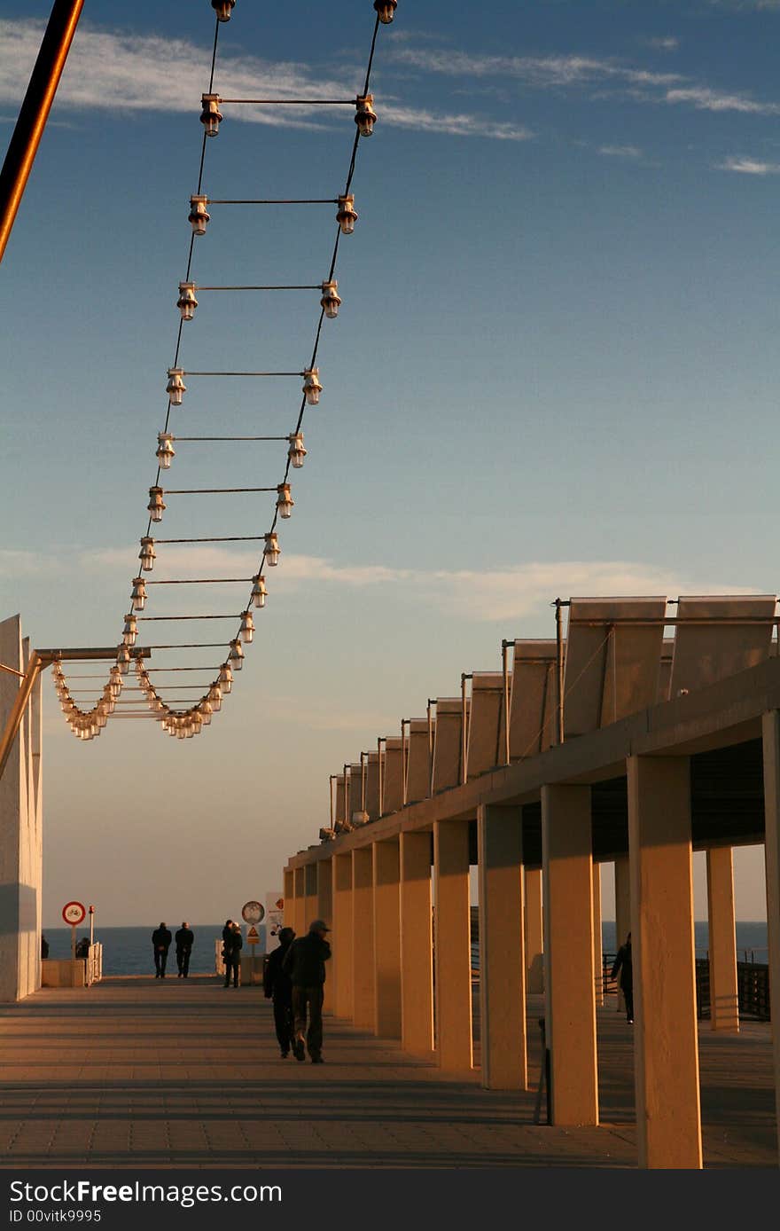 Promenade on the dock at the sunset