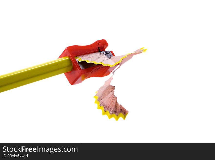 A pencile and sharpener isolated on a white background. A pencile and sharpener isolated on a white background.