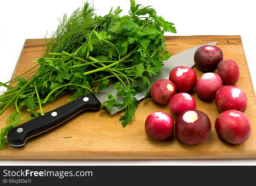 Radish, greenery and knife isolated. Radish, greenery and knife isolated