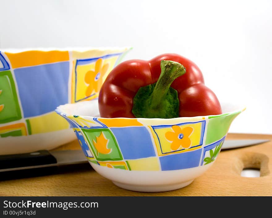 Red pepper in plate isolated