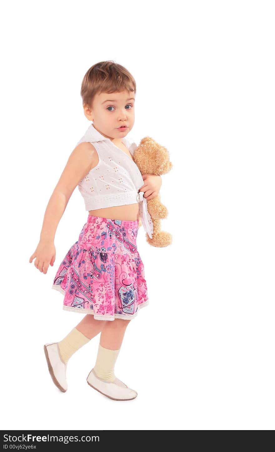 Little girl in skirt with toy