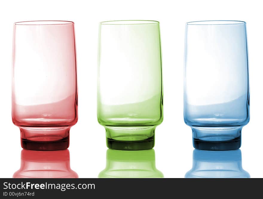 Red, green and blue glass isolated over white background, with reflection. Red, green and blue glass isolated over white background, with reflection