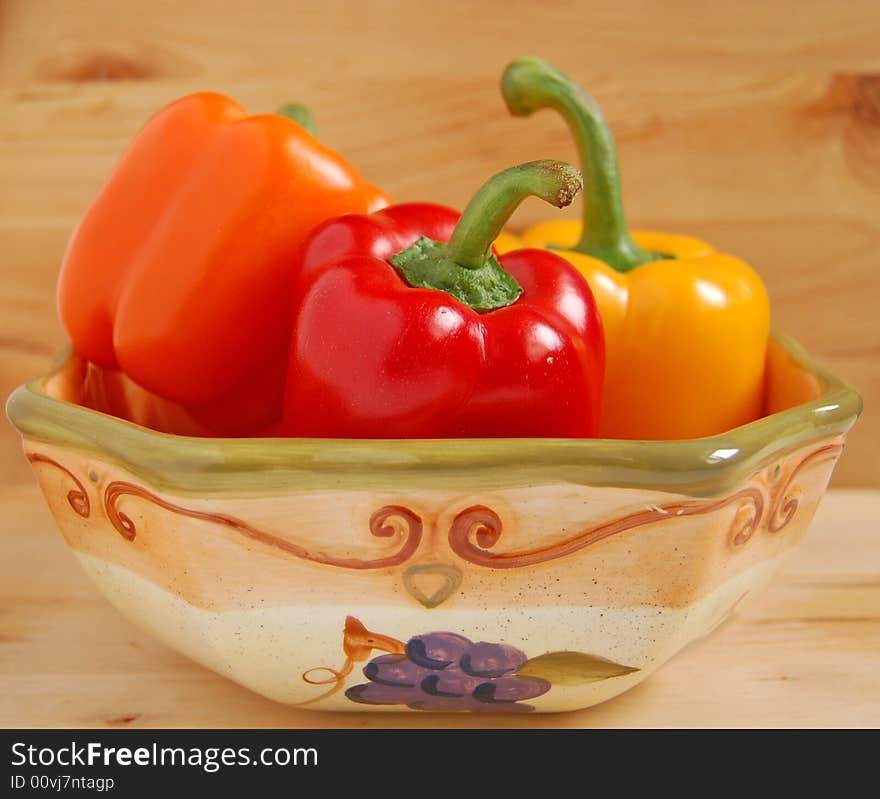 Red,yellow and orange peppers in bowl