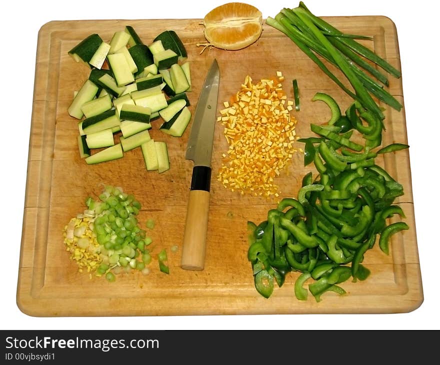 A cutting board with ingredients for preparing Asian style cuisine. A cutting board with ingredients for preparing Asian style cuisine.